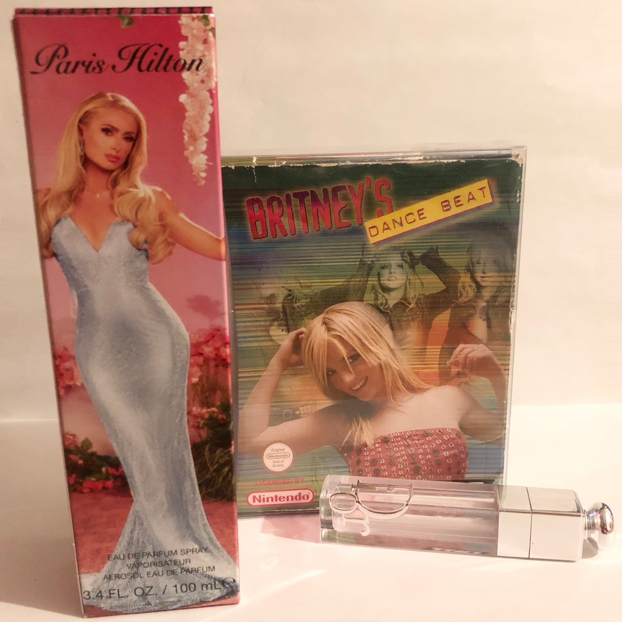 A box for Paris Hilton perfume, Britney Spears's Dance Beat gameboy game, and a bottle of Dior lip gloss, which while not in the page, is my makeup brand.