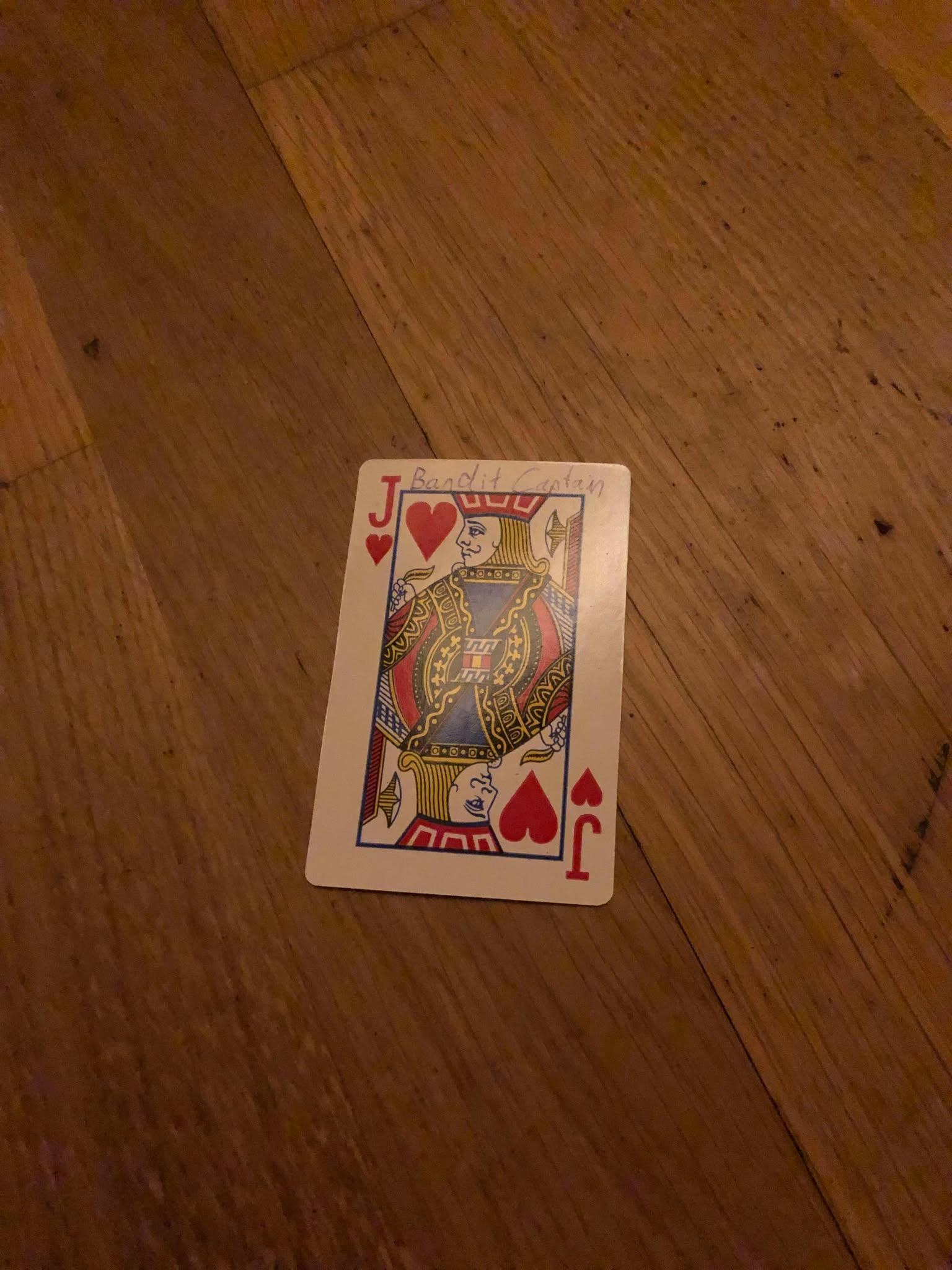 The jack of hearts, thrown to the floor in front of the creature.