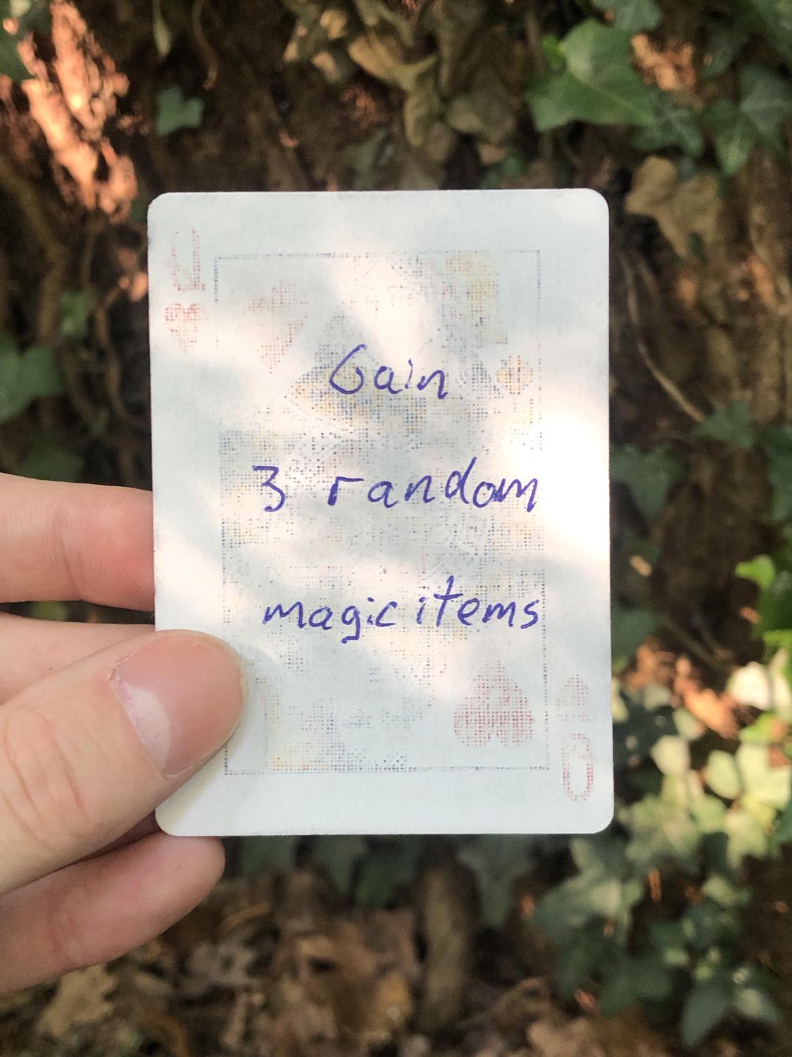 The queen of hearts, held above the detritus on the ground. Gain 3 random magic items.