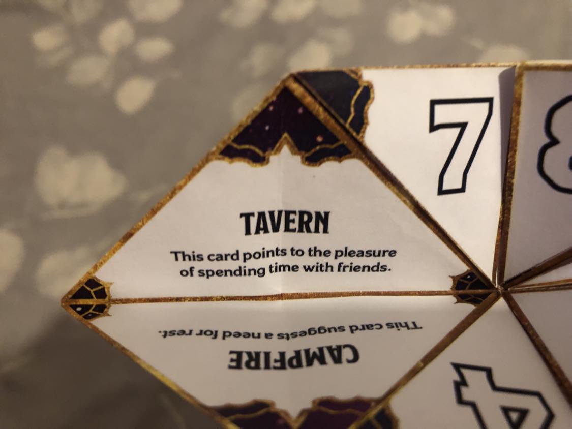 The fortune teller open to your fortune. 6, Tavern. This card points to the pleasure of spending time with friends.